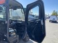 A 2018 Kubota RTV-X 1100 C with an open door revealing the interior dashboard and controls