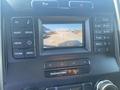 A digital display showing a rearview camera view for a 2017 Ford F-150 with guidelines indicating parking direction