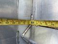 A close-up view of a 2020 Chevrolet Silverado's metallic structure with a measuring tape aligned against it showing a measurement of approximately 72 inches
