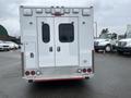 A 2016 Chevrolet Express with a white exterior and double rear doors designed for emergency services