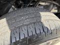 Close-up of a tire from a 2016 Chevrolet Silverado 2500HD showing tread pattern and texture
