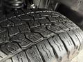 Close-up of a tire from a 2012 GMC Canyon showing detailed tread patterns and grooves
