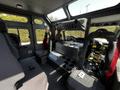Interior of a 2006 Emergency One Fire Truck featuring multiple seats control panel and space for firefighting equipment