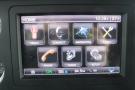 Dashboard display of a 2015 Kenworth T660 showing home screen with options for truck settings navigation and audio