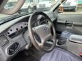 Interior view of a 2004 Ford Explorer Sport Trac showing the steering wheel dashboard and gear shift