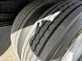 Close-up of a treaded tire from a 2017 Hino 155 showing worn tire grooves and surface details