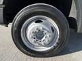 A close-up of a 2008 Ford F-450 SD wheel showcasing a silver rim and a Continental tire with visible tread patterns