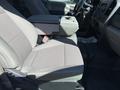 A gray cloth seat in the interior of a 2017 Ford F-350 SD with a center console and a view of the dashboard and steering wheel