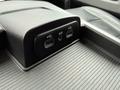 A close-up of the console area in a 2018 RAM 1500 featuring two USB ports and an AUX input