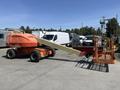 A 2008 JLG Boom Lift with orange coloring and a yellow extending arm, equipped with a work platform at the end of the arm for elevated tasks