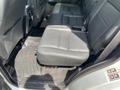 Interior view of the back seat of a 2006 Land Rover LR3 featuring black leather upholstery and floor mats