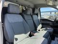 Interior of a 2023 Ford F-550 showing three gray fabric seats with headrests and seat belts