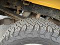 Close-up of a heavy-duty tire tread from a 2017 Ford F-250 SD showing deep grooves designed for traction and stability