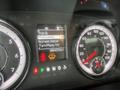 Dashboard of a 2019 RAM 1500 Classic showing trip information odometer reading fuel gauge and warning light indicators