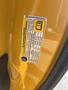 A 2013 Chevrolet Silverado 1500 with a yellow exterior showcasing a fuel information label on the driver's side door jamb