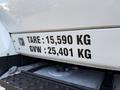A 2011 International 7500 truck featuring a weight label displaying tare weight of 15590 kg and gross vehicle weight of 25401 kg