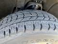 A close-up of a tire from a 2018 GMC Sierra 1500 showing the tread pattern and sidewall markings