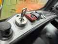 Close-up of the control panel of a 2018 Doosan DL300-5 featuring ignition key, buttons, and levers for operating the machinery