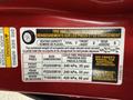 A 2016 Mitsubishi Outlander with a tire information label detailing seating capacity, tire specifications, and pressure recommendations