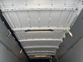 Interior view of a 2019 Mercedes-Benz Sprinter van showing the white ceiling with overhead lights and structural beams