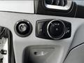 Close-up of the control panel in a 2015 Ford Transit featuring switches for lights and a vehicle settings dial