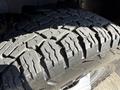 Close-up of a worn tire tread on a 2017 Chevrolet Express showing distinct grooves and patterns