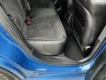 A 2022 Dodge Charger with black leather and suede seats in the back interior showcasing the sporty design and spaciousness of the vehicle