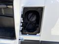 A close-up view of the fuel cap of a 2016 RAM Promaster showcasing the fuel access door and the cap attached by a tether