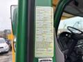 A 2015 Freightliner M2 106 with a label on the door detailing manufacturer information and specifications including tire pressure and vehicle identification number