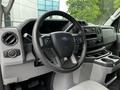 Interior view of a 2021 Ford E-450 showing the steering wheel dashboard and control panel