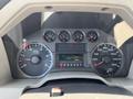 Dashboard of a 2008 Ford F-450 SD featuring gauges for RPM speed fuel temperature and a digital display showing 165 km and 143912.5 km driven
