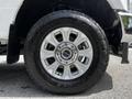 A close-up of a 2020 Ford F-350 Super Duty wheel featuring a silver alloy rim with multiple spokes and a large rugged tire labeled Open Country All Terrain