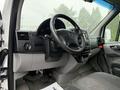 Interior view of a 2016 Mercedes-Benz Sprinter showing the steering wheel dashboard and controls