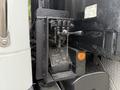 Close-up of the control panel on a 2019 Freightliner M2 featuring levers and gauges for various functions and operations of the truck