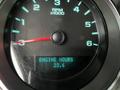 Dashboard of a 2011 GMC Sierra 3500HD displaying the RPM gauge and engine hours reading 23.6