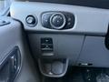 Interior controls of a 2022 Ford Transit including lighting controls and a button panel for vehicle functions