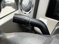 Close-up of a 2008 Ford F-450 SD's windshield wiper control stick showing various settings along its surface