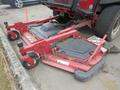 A 2013 Toro Grounds Master 5910 lawn mower with a red frame and large cutting deck attachments in the foreground
