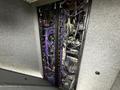 A close-up view of the interior wiring and electronic components of a 2011 Ford F-650 detailing multiple cables and connections arranged vertically