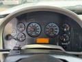 Dashboard of a 2014 International TerraStar featuring various gauges for RPM speed water temperature and fuel levels along with an odometer display