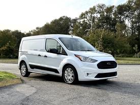 2019 Ford Transit Connect in white with a sleek design featuring a distinct front grille and modern styling