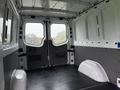Interior view of a 2016 Mercedes-Benz Sprinter van showing a spacious cargo area with a flat floor and rear double doors