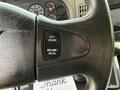 Close-up of the steering wheel of a 2014 International TerraStar showing the cruise control buttons for setting and resuming speed
