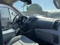 Interior view of a 2016 Ford Transit van showing the dashboard steering wheel and seating area
