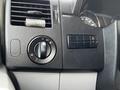 Close-up of the control panel in a 2012 Mercedes-Benz Sprinter featuring light controls and air conditioning settings