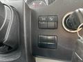 Close-up of the dashboard controls of a 2017 Mercedes-Benz Sprinter showing buttons for various functions and a key in the ignition