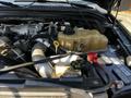 Close-up view of a 2008 Ford F-550 engine with visible components like the coolant reservoir and various hoses and wires