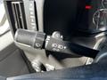 Close-up of the control stalk in a 2019 Chevrolet Express featuring settings for headlights and windshield wipers along with additional indicator symbols