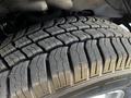 Close-up of a tire from a 2019 Chevrolet Express showcasing tread patterns and grooves