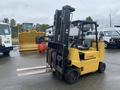 A yellow 2010 Hyster S80XLBCS forklift with two forks and a black mast is positioned in the foreground